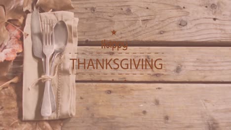 Animation-of-happy-thanksgiving-day-text-over-cutlery