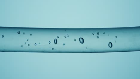 close-up of a tube filled with liquid and bubbles