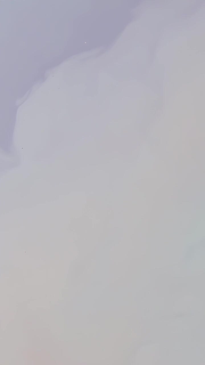 Vertical video: Drifting large cumulus cloud shifting in sky while camera filming, driven by breeze