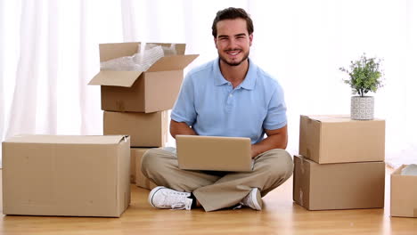 Man-using-his-laptop-in-his-living-room