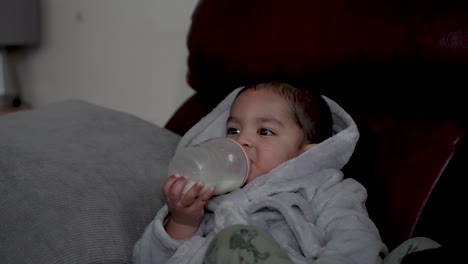 Cute-Boy-Toddler-Drinking-Milk-While-Lying-Down