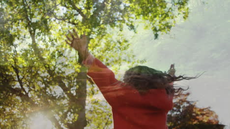 little girl dancing under the trees