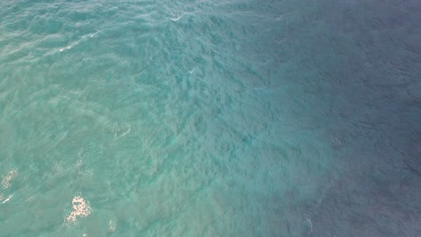 Small-tradicional-wooden-fisher-boat-paddling-in-the-ocean