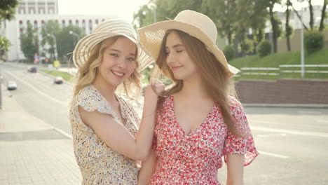 two young women enjoying a sunny day in the city