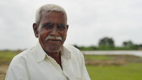 portrait of an indian farmer in a rural setting