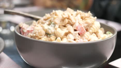 Plate-of-cream-and-herb-pasta-on-table-,