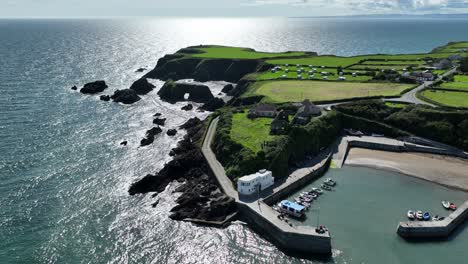 aerial coast ireland picturesque fishing harbour of boatstrand copper coast waterford late afternoon in summer