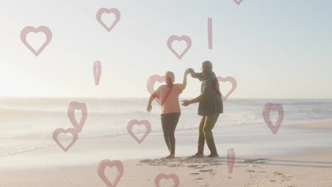 dancing on beach, couple enjoying moment with heart animations in background