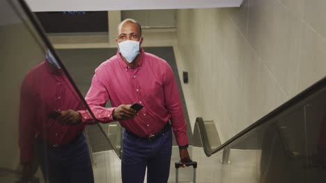 african american man on the go wearing coronavirus covid19 mask