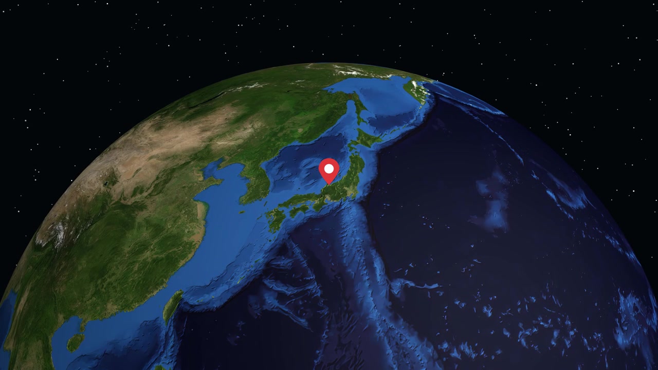 Digital globe rotates and zooms from space into Toyama Japan with red location marker