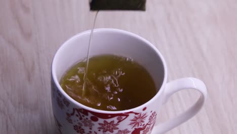 Dipping-tea-bag-into-water
