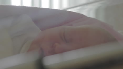 newborn baby falling asleep in hospital