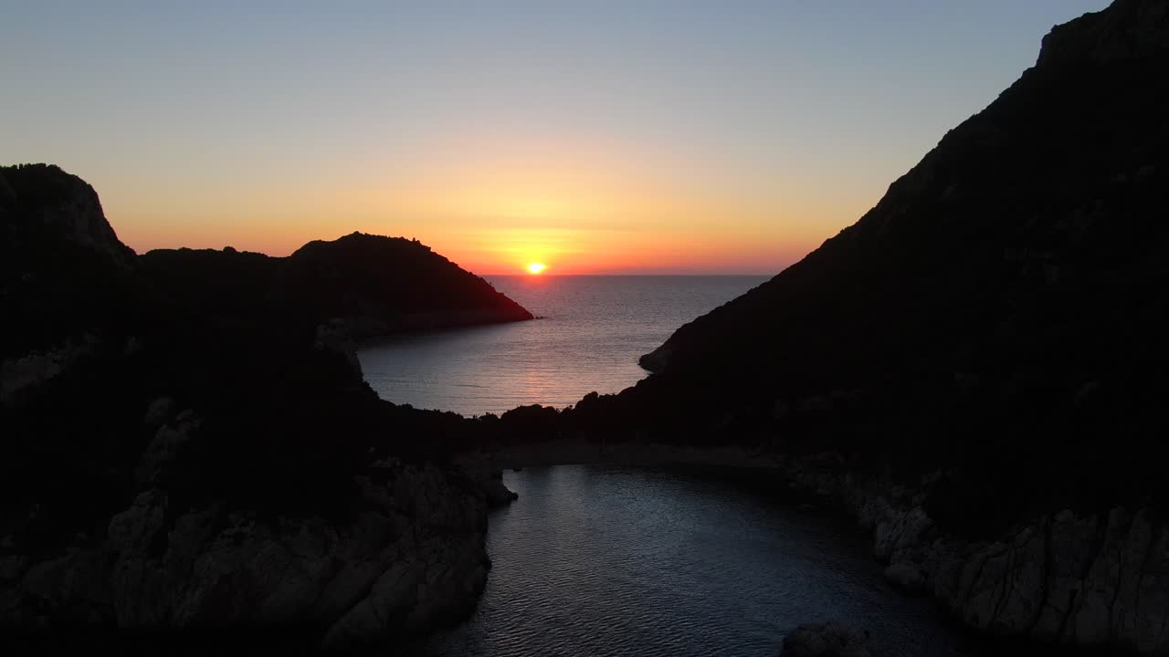 Stunning Sunset Over Calm Sea Between Cliffs