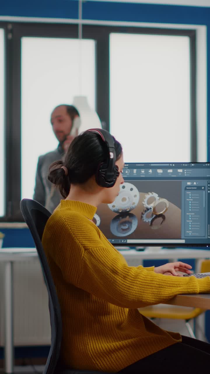 Vertical video Happy woman mechanical engineer putting on headphones listening music