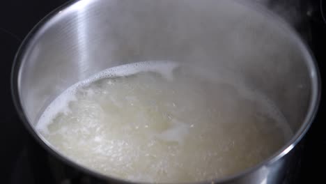 boiling rice in a pot