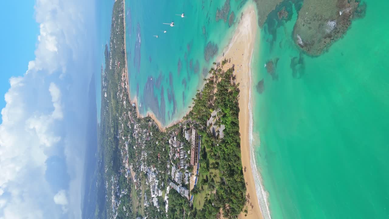 Las Terrenas village vertical aerial with Punta Popy exquisit turquoise waters beach and underwater coral reefs. Tourism hot spot in the Dominican Republic, famous for kite surfing