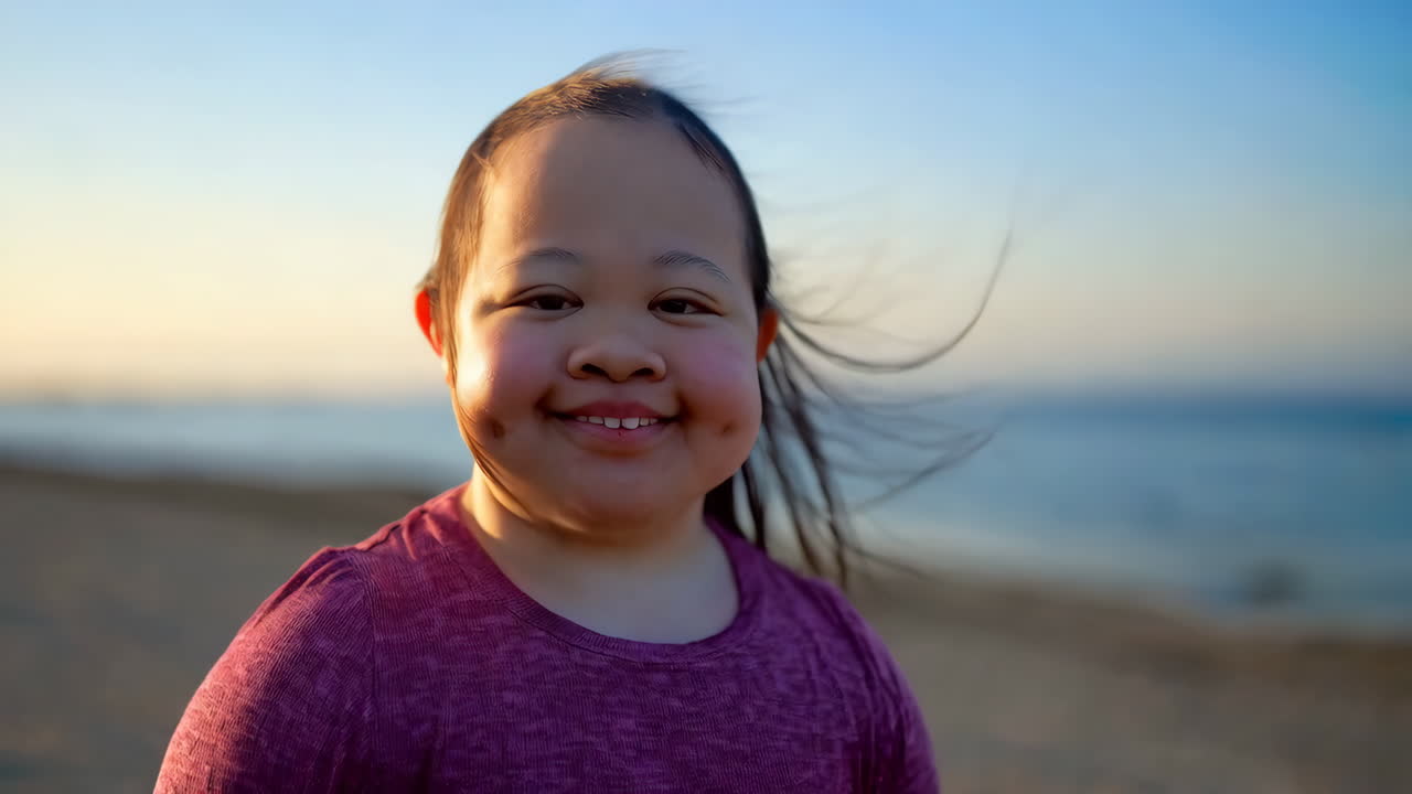 Smiling child at the beach during sunset