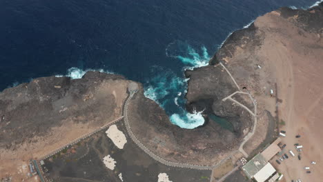 Atlantic-coast-on-Sal-Island,-Cape-Verde,-volcanic-stone-contrasting-with-the-Atlantic-Ocean