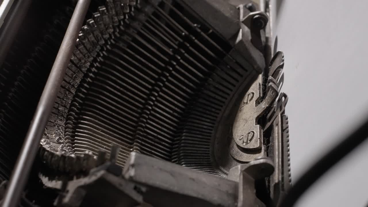 Detailed close-ups of a vintage typewriter in action, focusing on keys and typed words