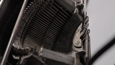 detailed close-ups of a vintage typewriter in action, focusing on keys and typed words