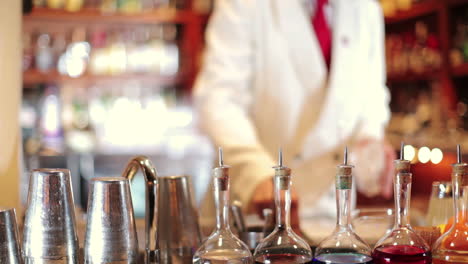 stylish waiter in cocktail bar