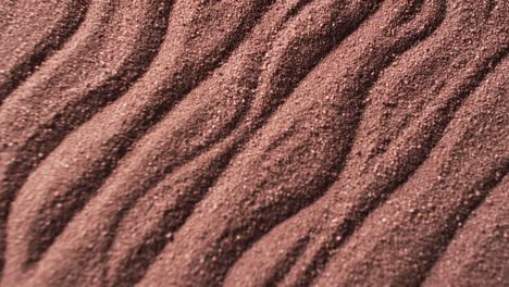 Video-of-close-up-of-brown-coloured-sand-with-pattern-and-copy-space-background