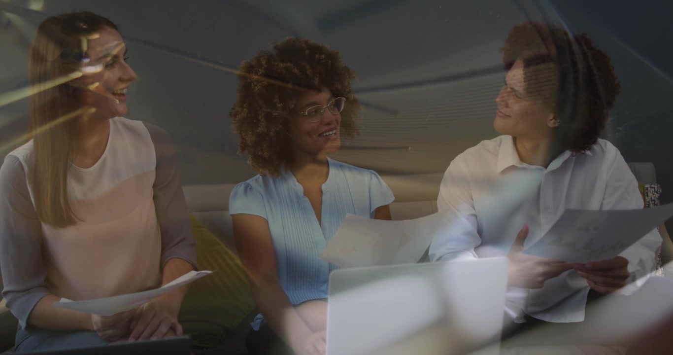 Composite video of close up of ticking clock against diverse businesspeople discussing at office