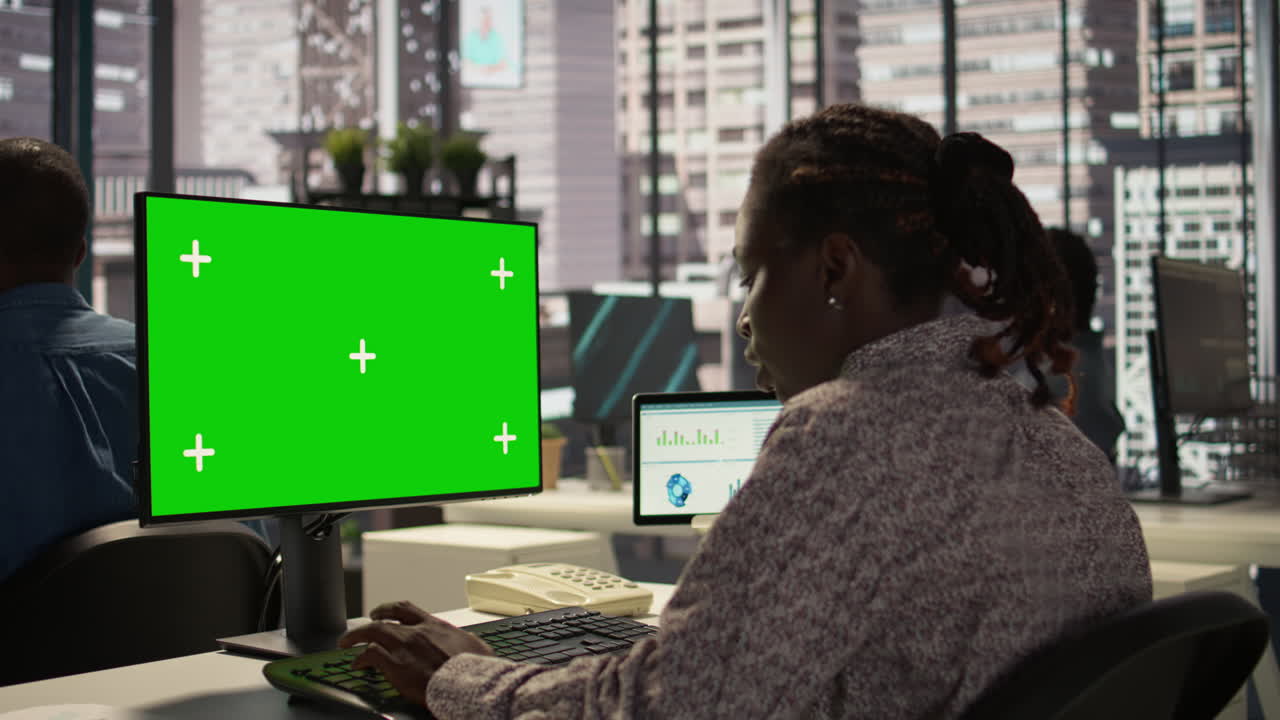 Businesswoman Working at a Computer in Modern Office