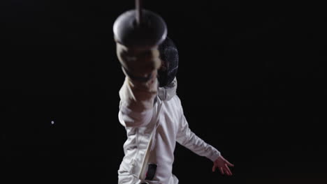 a fencer in action with a foil