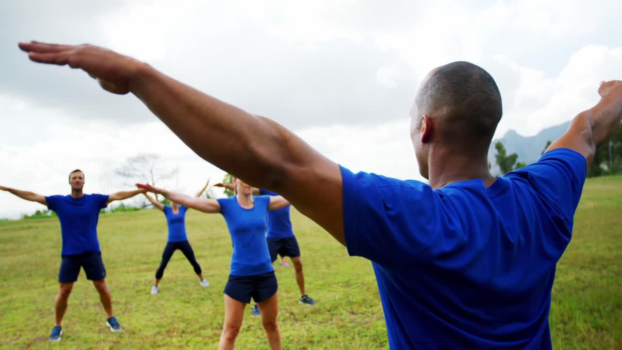 Fit people performing stretching exercise 4k