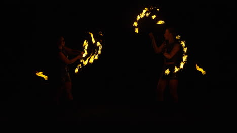 fire twirling performance at night