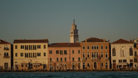 colorful venetian houses along the canal at sunset