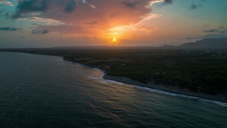 cliffs along playa matanzas beach with setting sun in background, bani in dominican republic