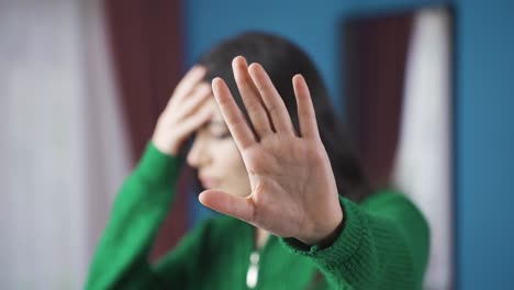 unhappy and traumatized young woman says stay at home.