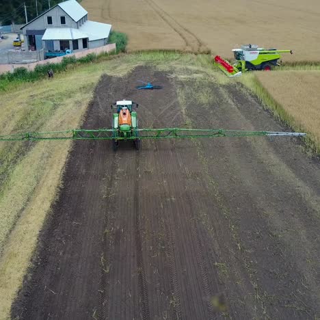 tractor spraying agricultural field