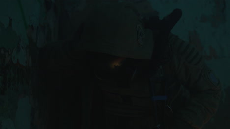 a wounded soldier in the abandoned military complex during the recon mission
