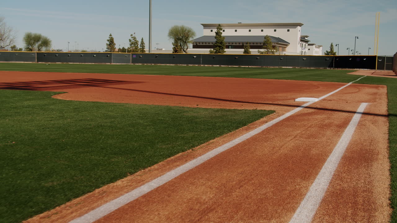 Baseball field with a building in the background