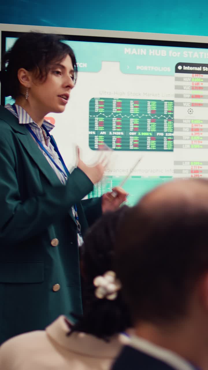 Businesswoman Presenting Financial Data on Screen in Office Meeting