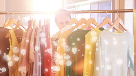 woman doing shopping surrounded by white bubbles effect