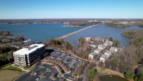 aerial-lake-norman-nc,-north-carolina,-causeway-bridge-and-new-development