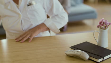 close-up shot of unrecognisable therapist filling in documents