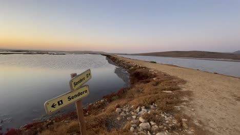 Slow-pan-of-the-trekking-footpaths-in-the-mashlands-of-Cadiz,-Spain