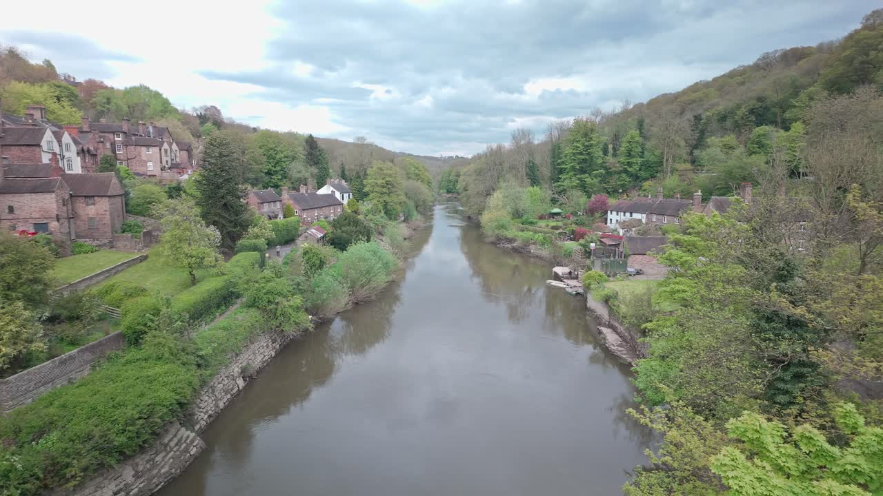 Elevated slow pan across River Severn Ironbridge valley gorge