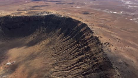 4k aerial of meteor crater or barringer crater in arizona, usa