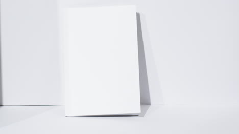 video of book with blank white pages and copy space on white background