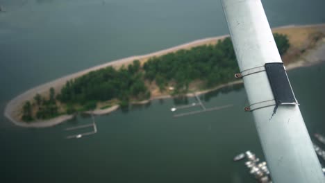 beautiful footage looking looking down on the wing strut of a small plane flying over the columbia river