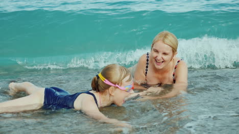 Mom-And-Daughter-Are-Having-Fun-In-Surf-Waves-On-The-Sea-Happy-Moments-With-Children-Slow-Motion-Vid