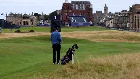 golfer standing with bag, preparing to play