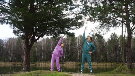 Couple-stretching-outdoors