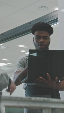 man working on laptop in office